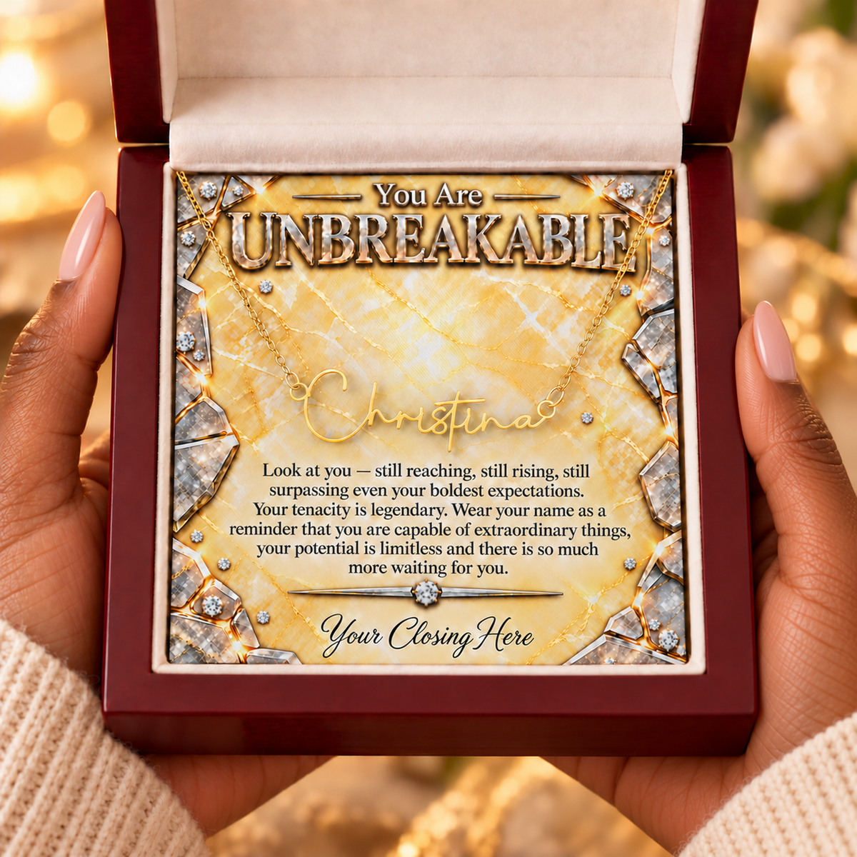 Unbreakable Sunburst Luxe message card in mahogany gift box held in hands