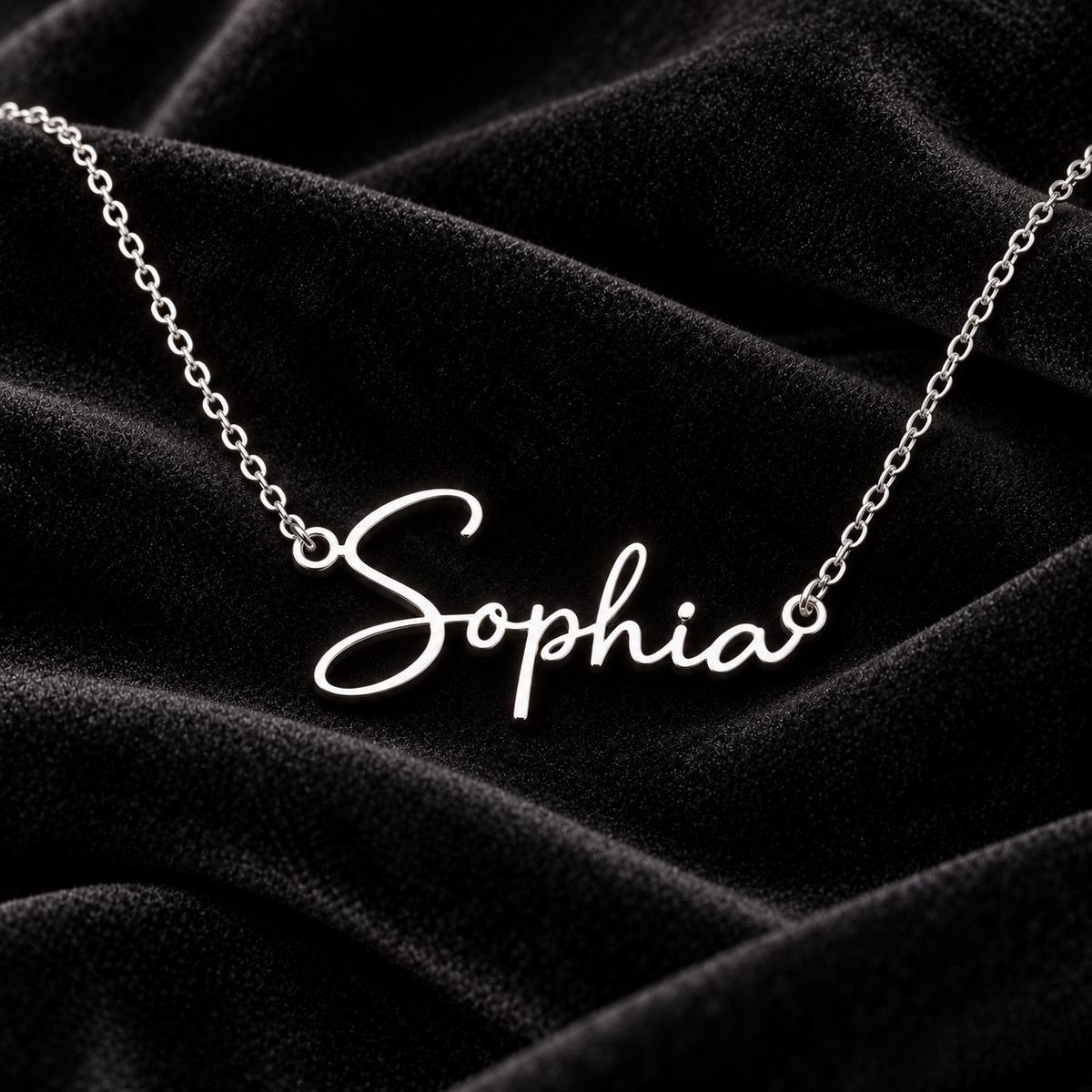 Silver Sophia name necklace on black velvet