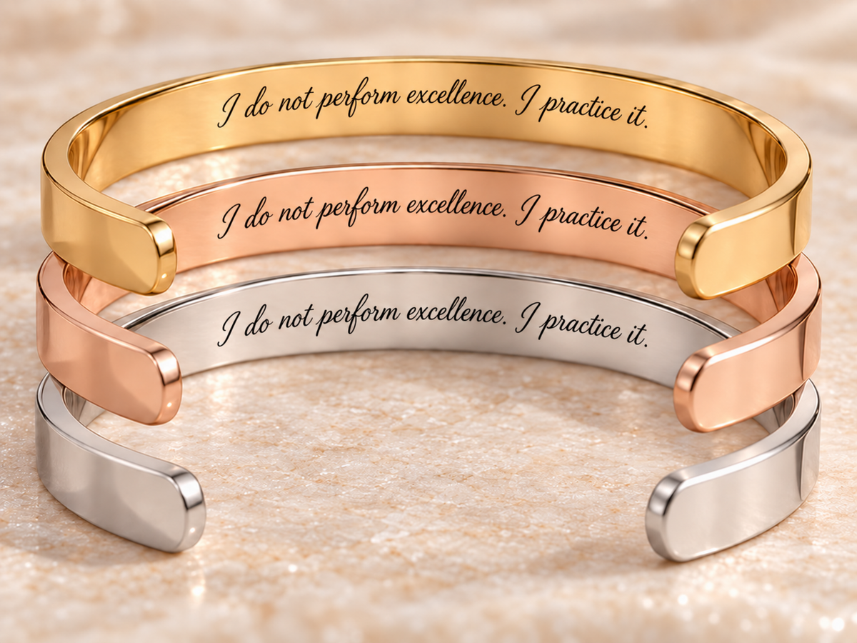 the STANDARD Verso cuff bracelet in gold, rose gold and silver, showing the hidden inside engraving: I do not perform excellence. I practice it.