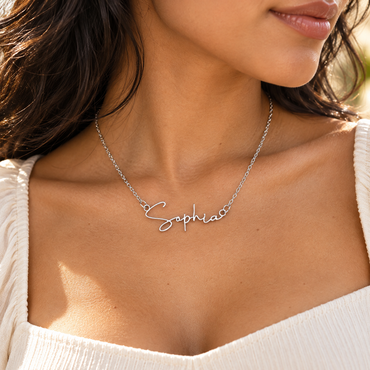 Woman wearing silver Sophia name necklace