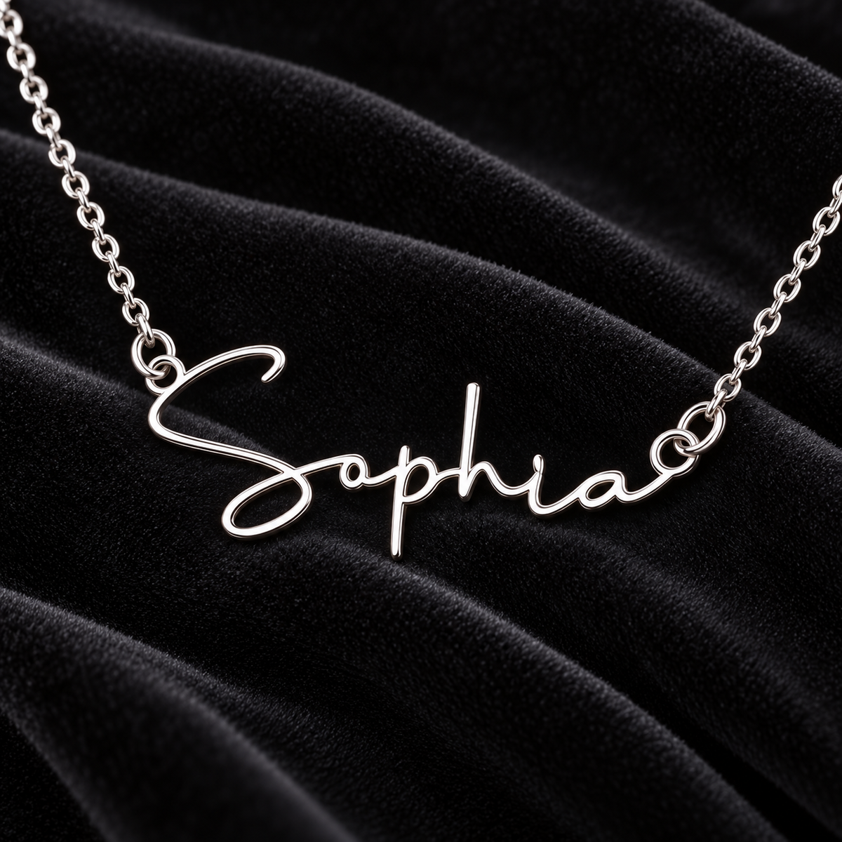 Silver Sophia name necklace on black velvet